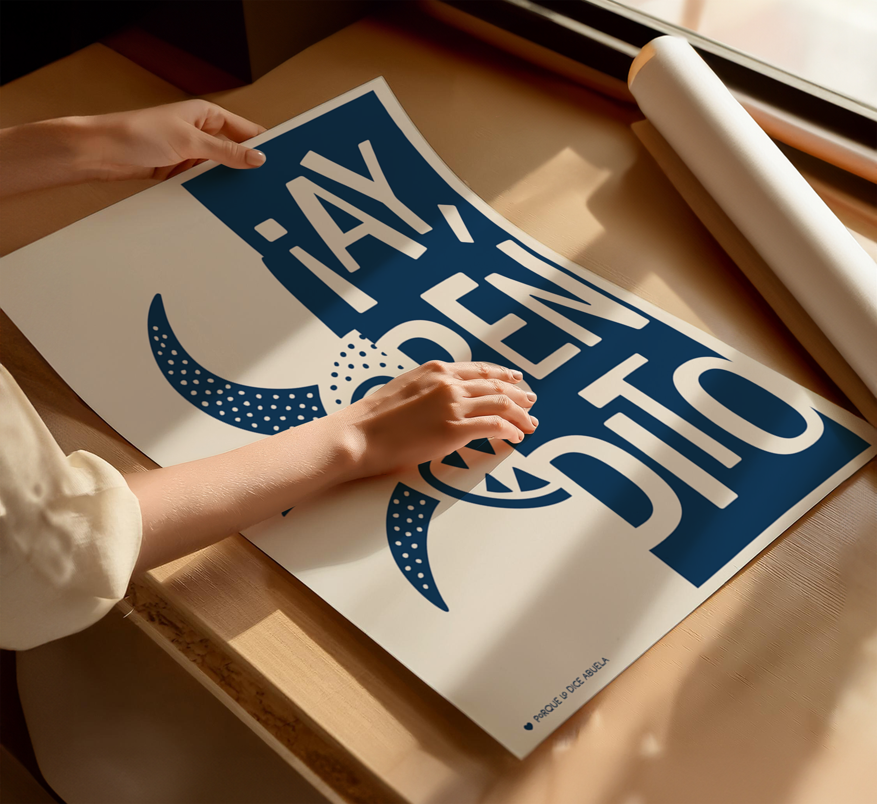 A person's hands are holding a large poster with a blue and white design featuring the text "I say 'ay' to you".