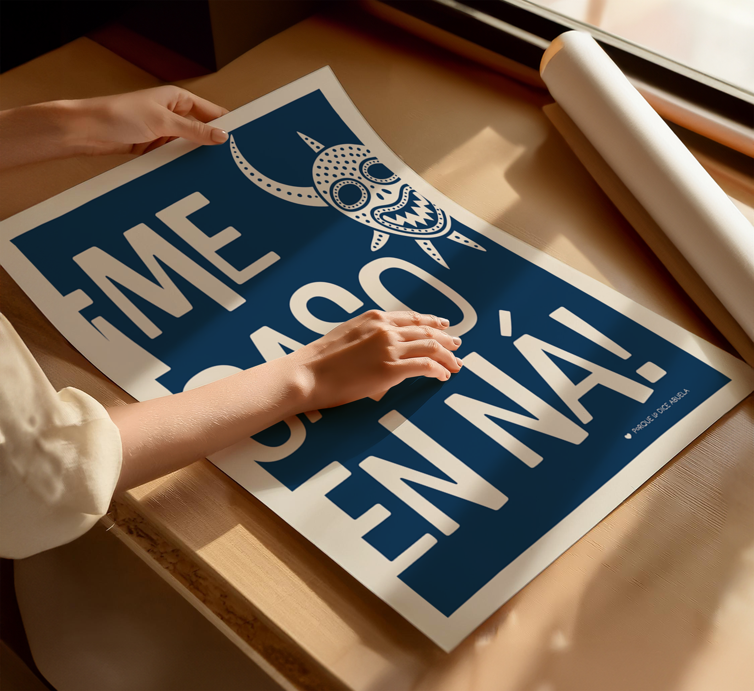 A person's hands are holding a large poster with a blue background and white text.