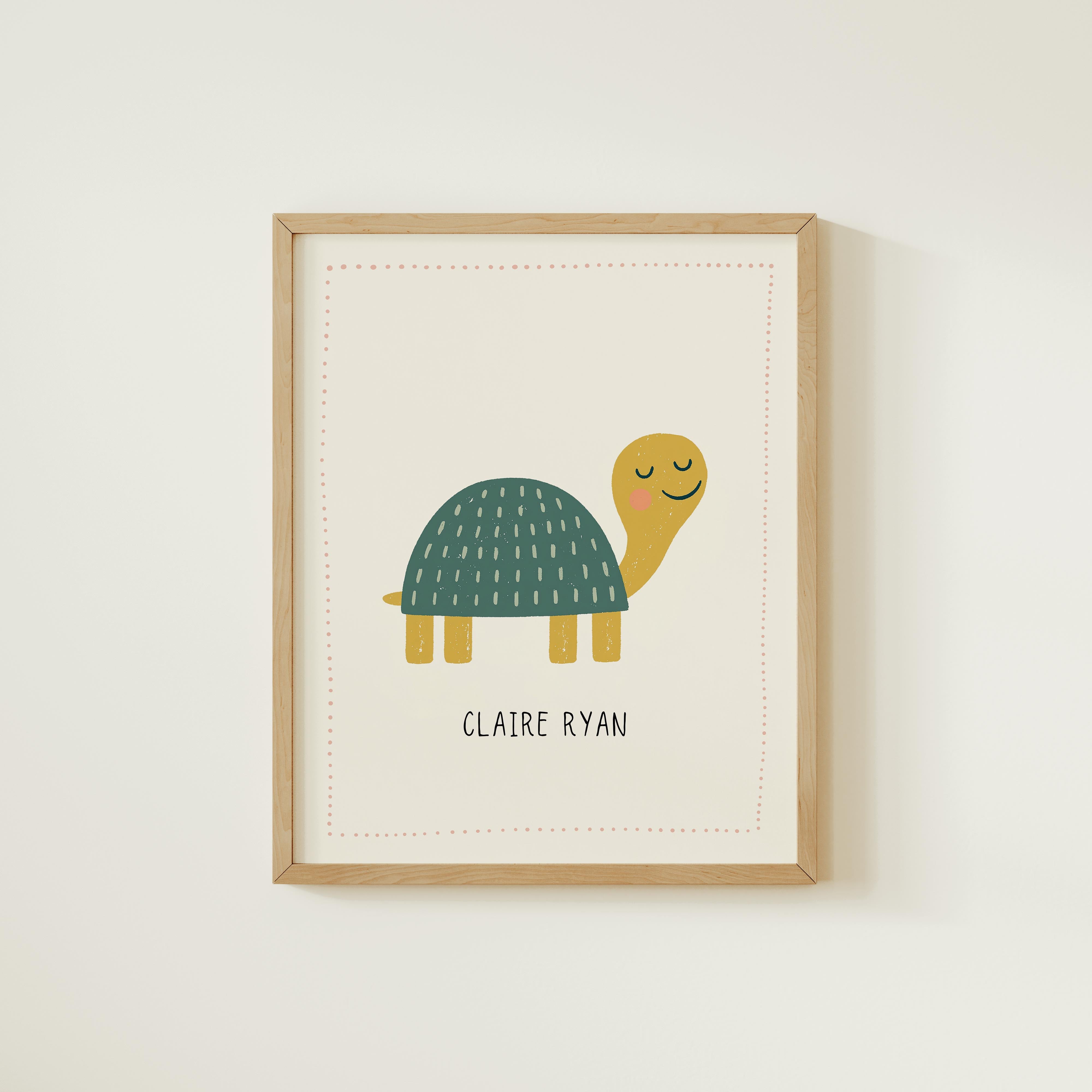 A framed illustration of a smiling turtle with a name tag.