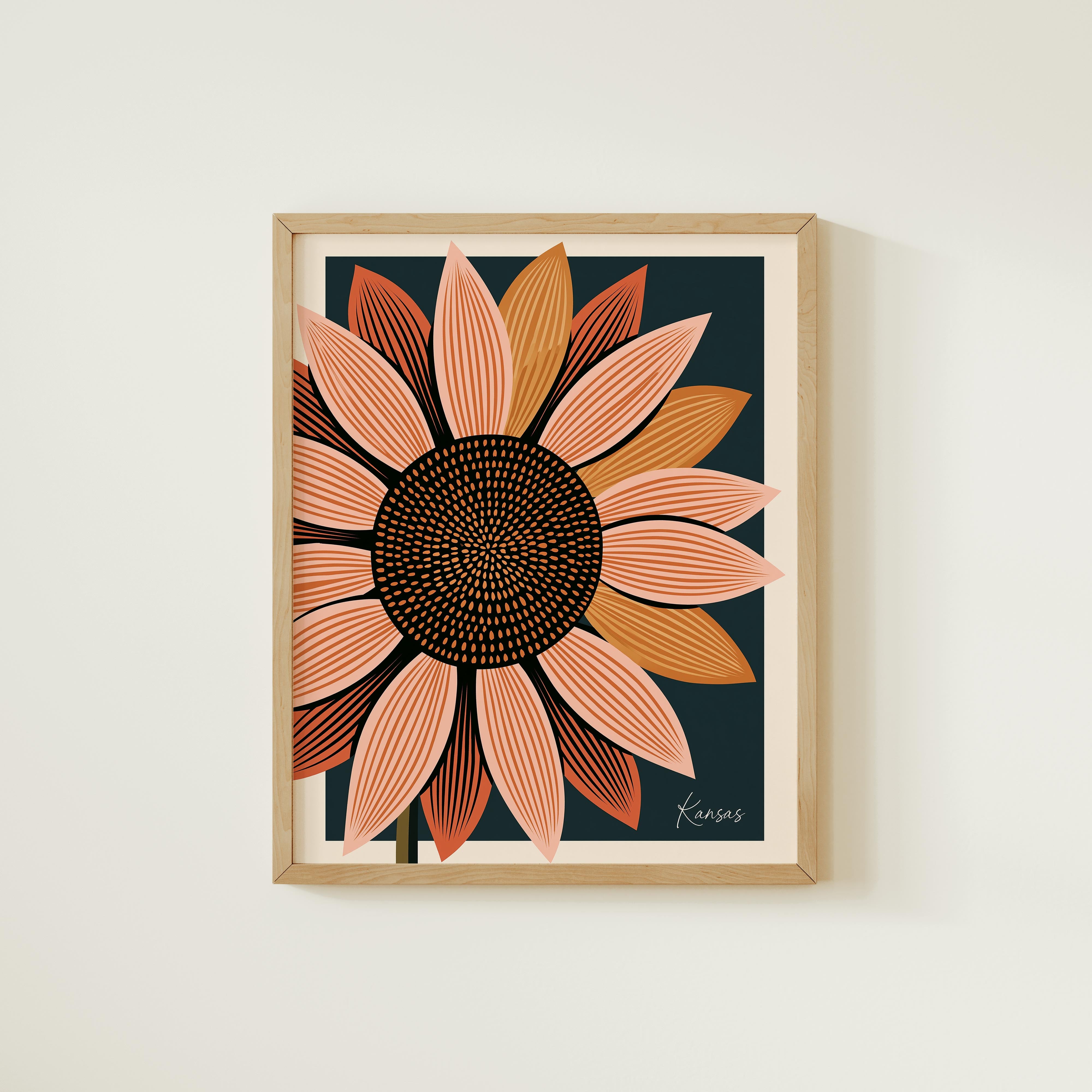 a framed print of a large, colorful sunflower with a dark background.
