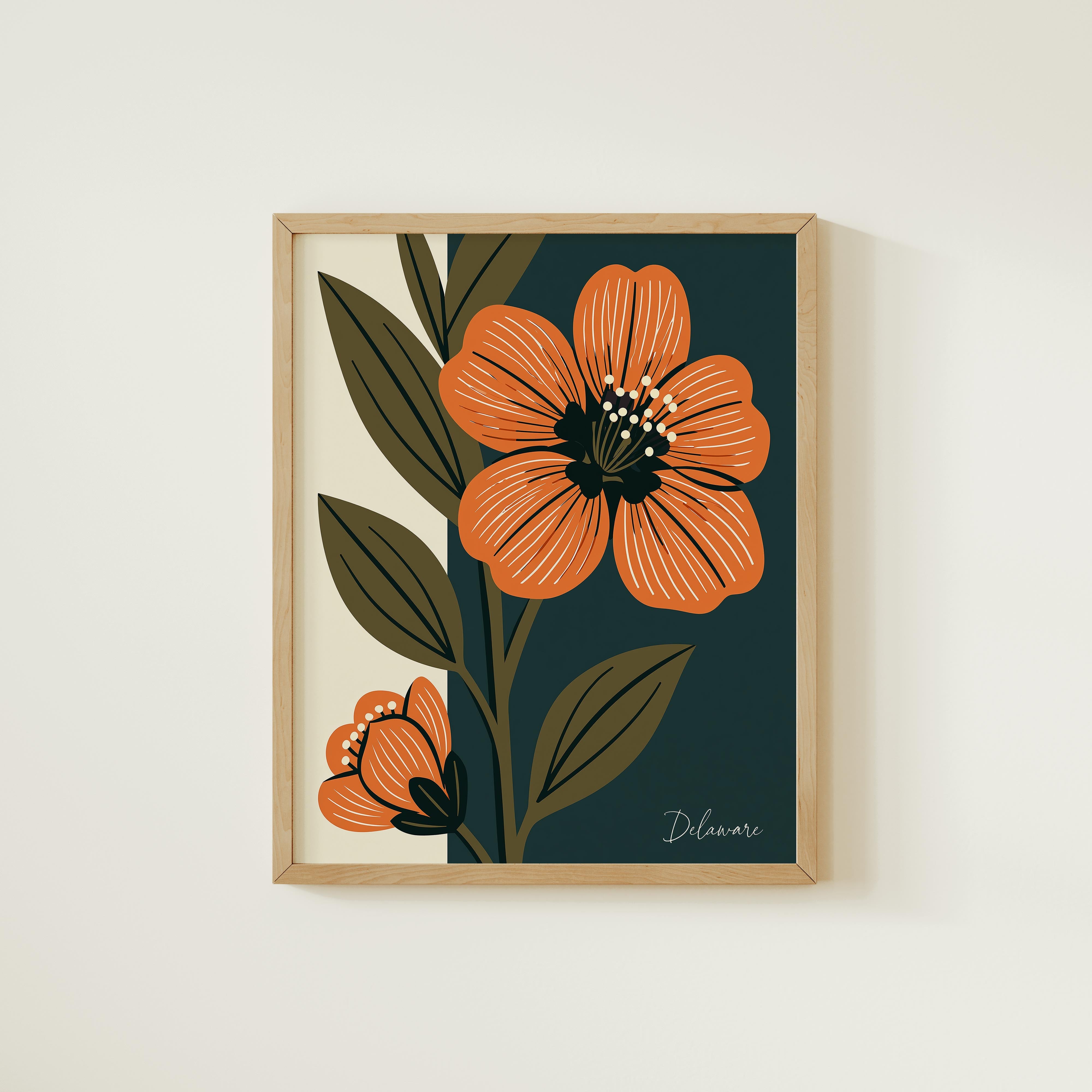 a framed artwork of two orange flowers with green leaves, set against a dark green background.