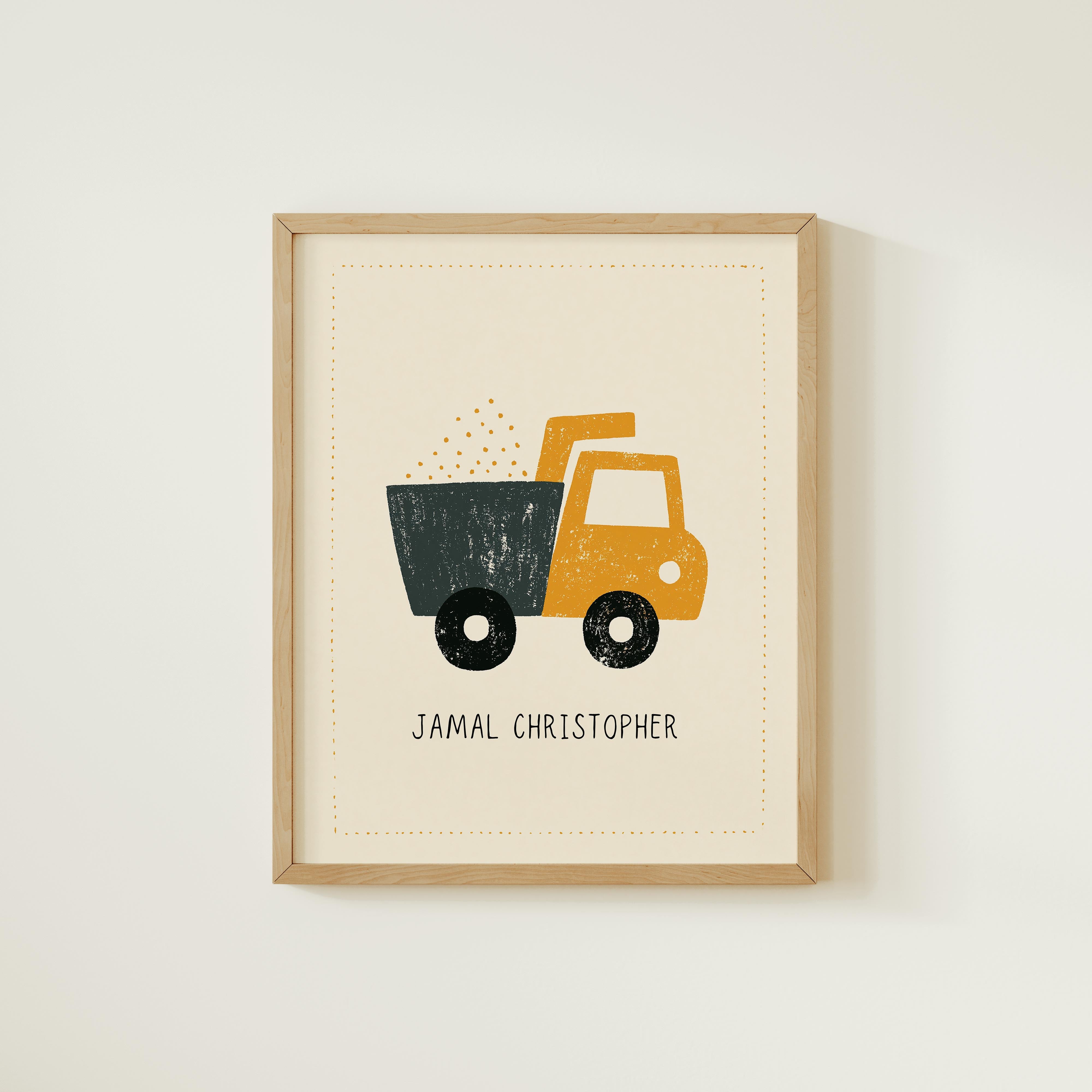 A framed print featuring a cartoon illustration of a yellow truck with a black cargo area, along with the name "Jamel Christopher" written below it.