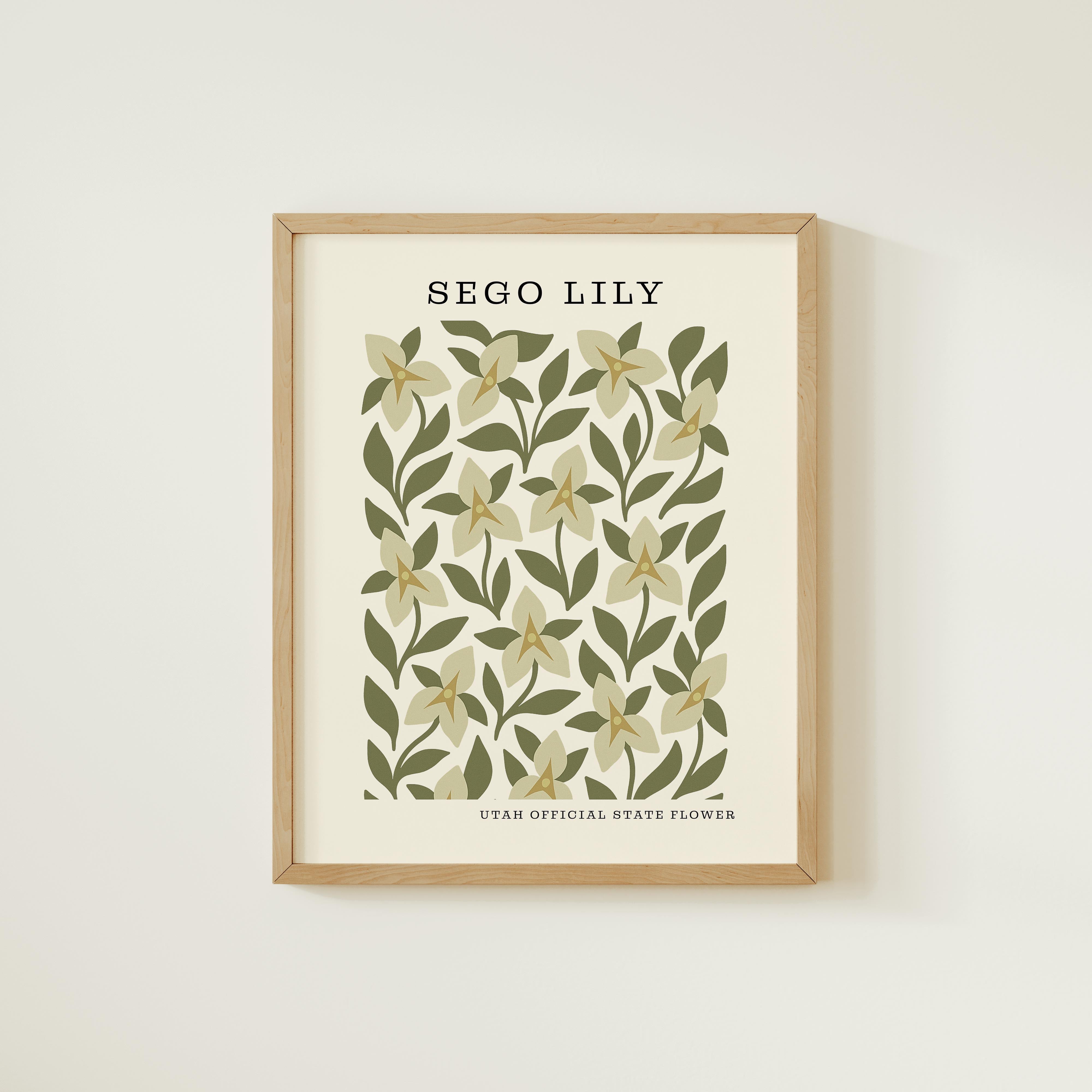 The image is a framed print featuring a repeating pattern of sego lily flowers and leaves on a beige background.