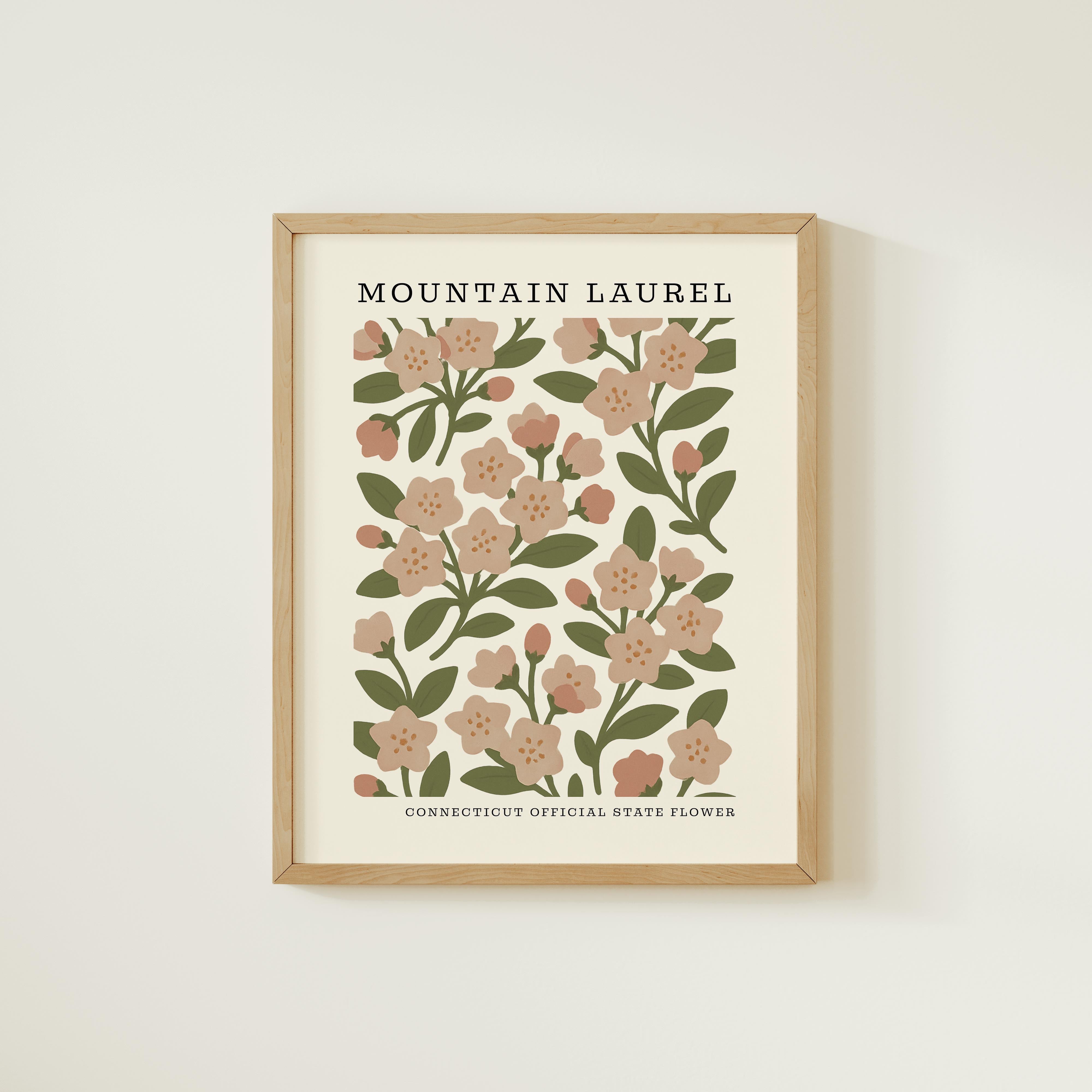 The image is a framed print featuring a floral design with pink flowers and green leaves.