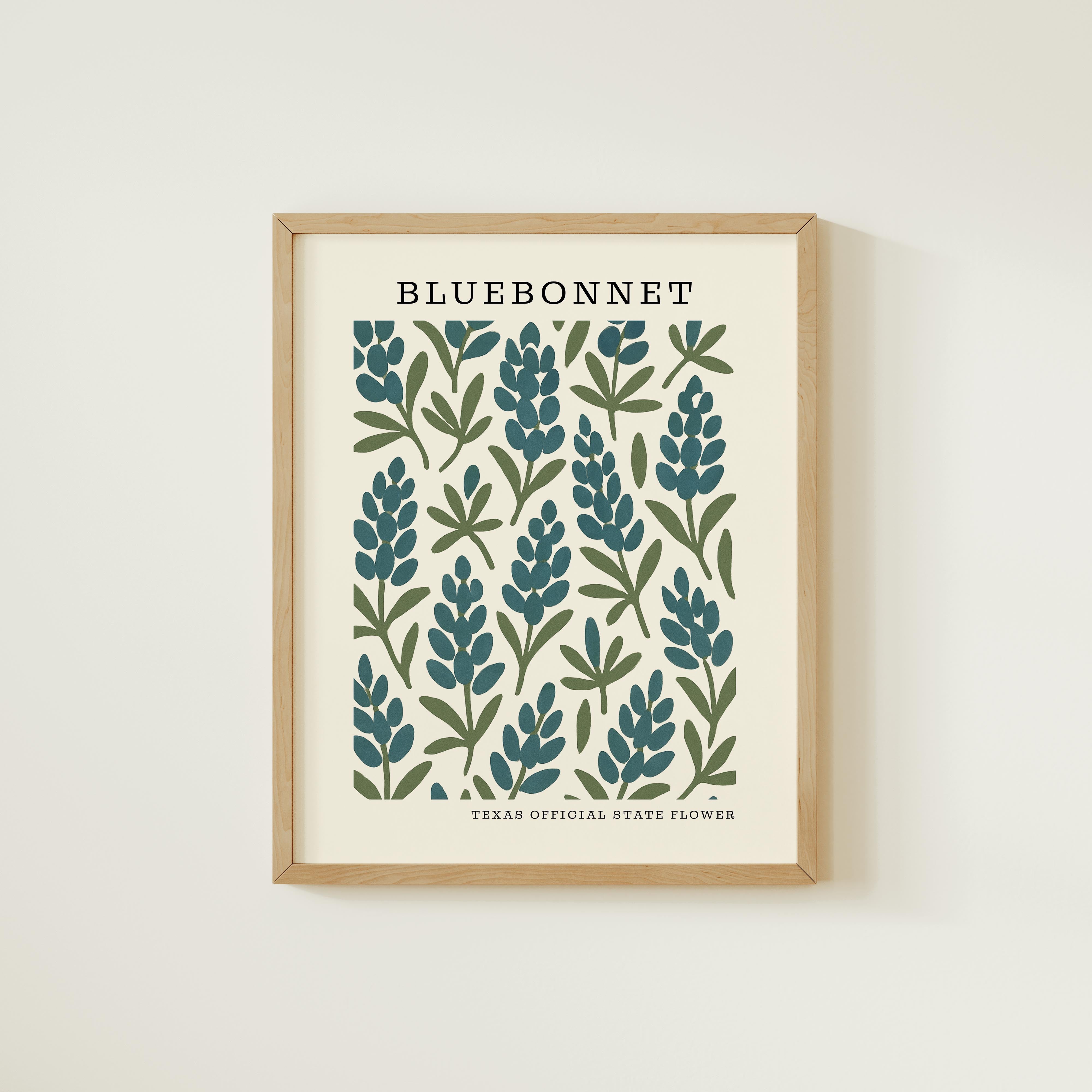 The image is a framed print featuring a repeating pattern of blue and green flowers or leaves, with the text "BLUEBONNET" prominently displayed at the top.