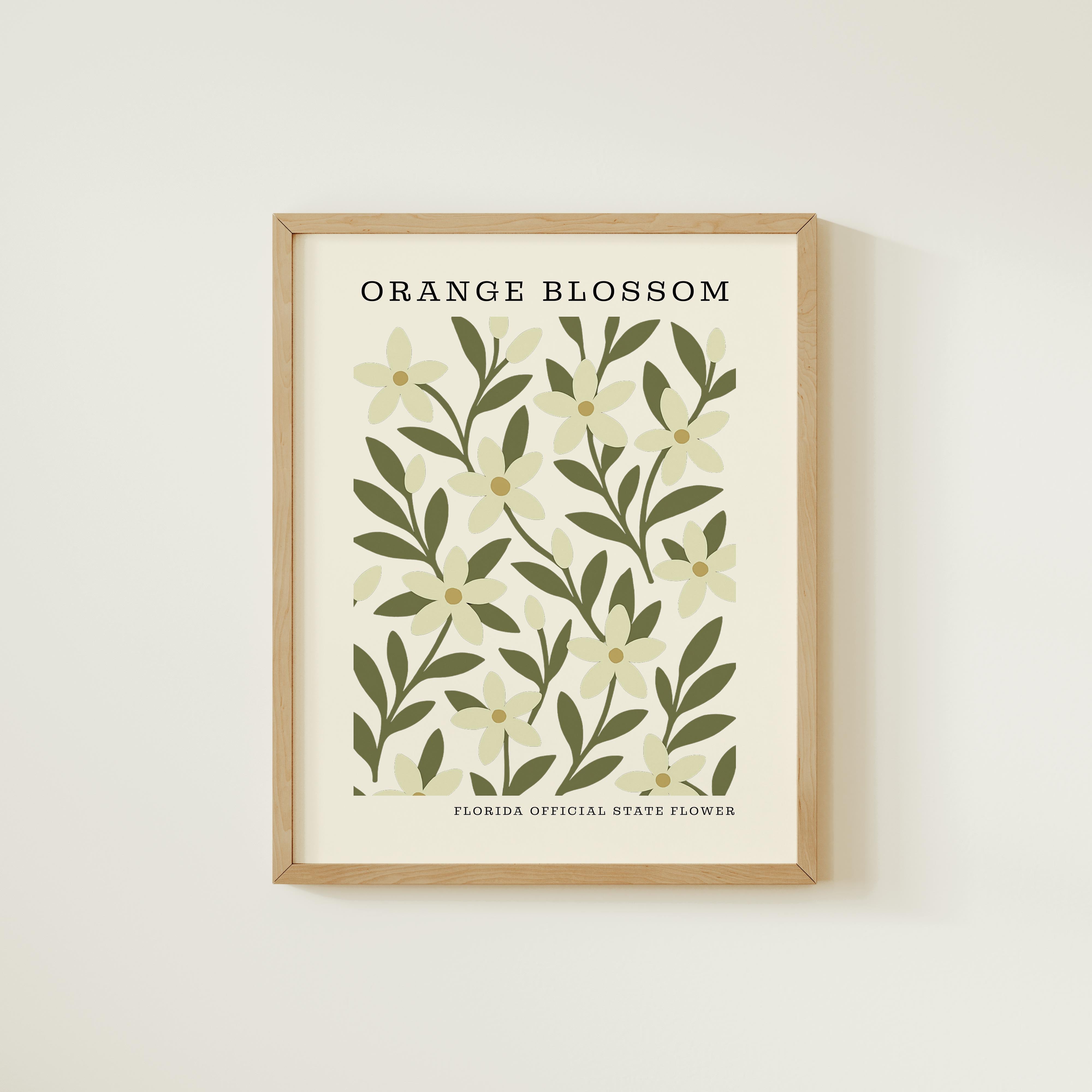 The image is a framed print featuring a repeating pattern of orange flowers and green leaves, with the text "ORANGE BLOSSOM" and "FLORIDA OFFICIAL STATE FLOWER" below the pattern.