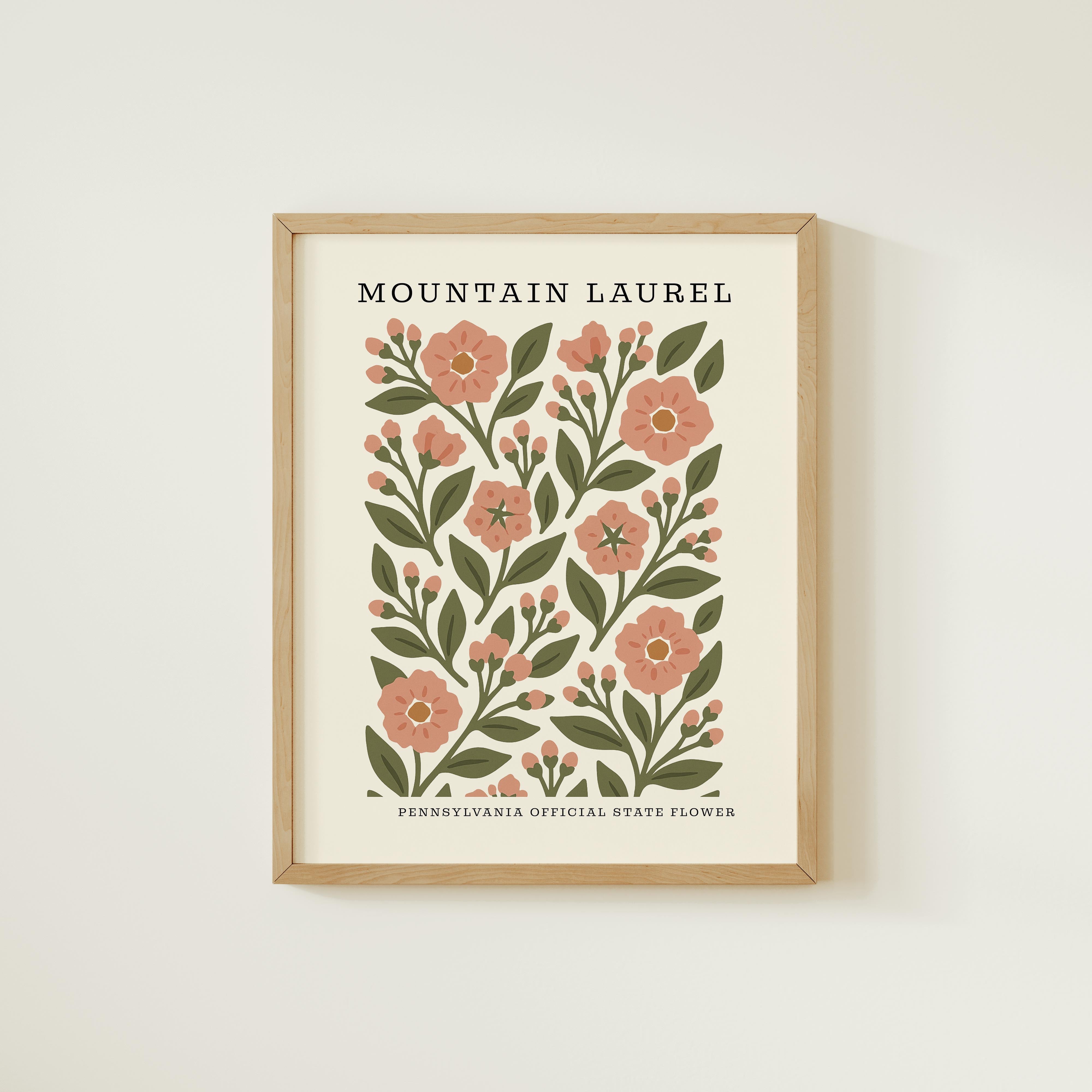 The image is a framed print featuring a floral design with pink flowers and green leaves.