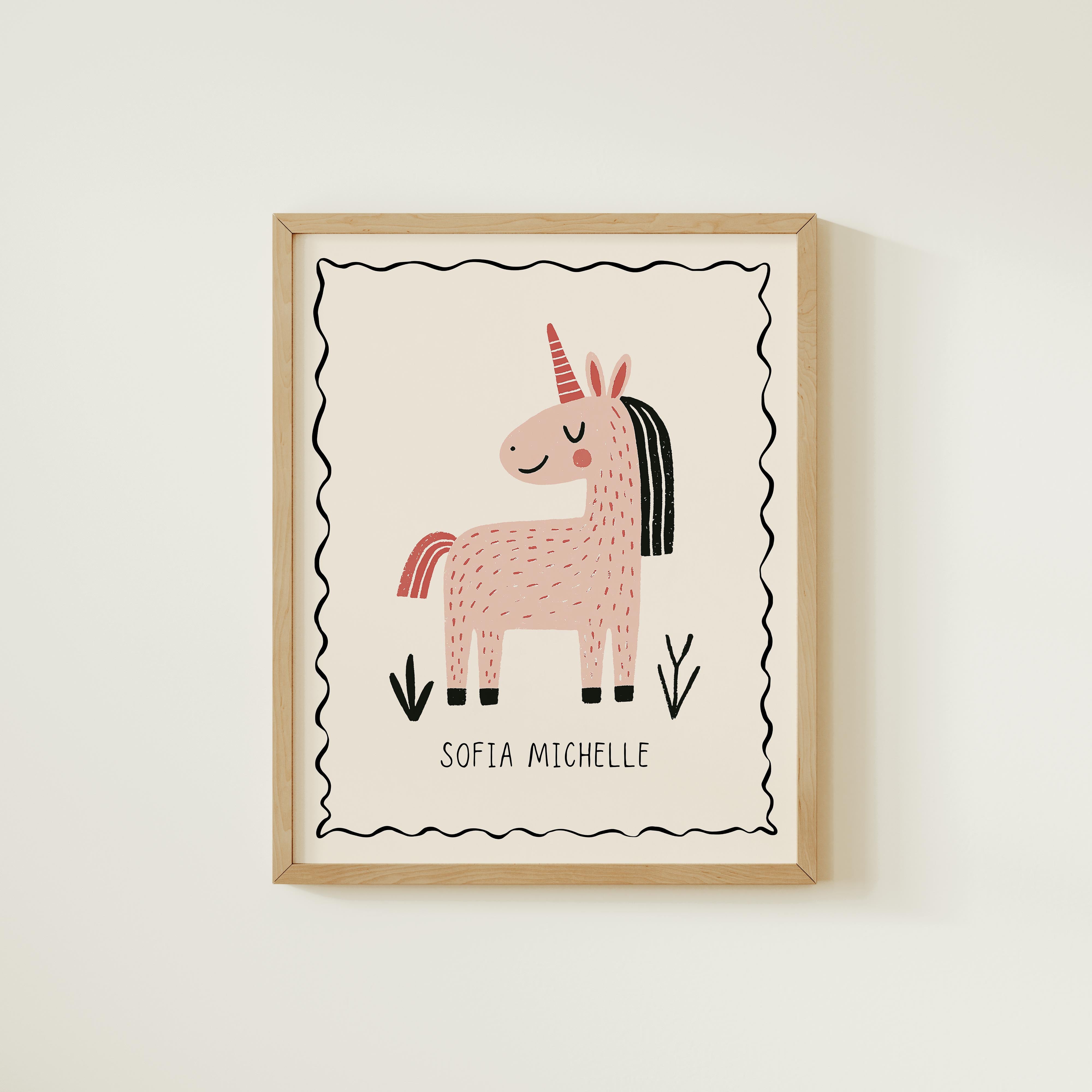 A framed illustration of a pink unicorn with the name "Sofia Michelle" written below it.