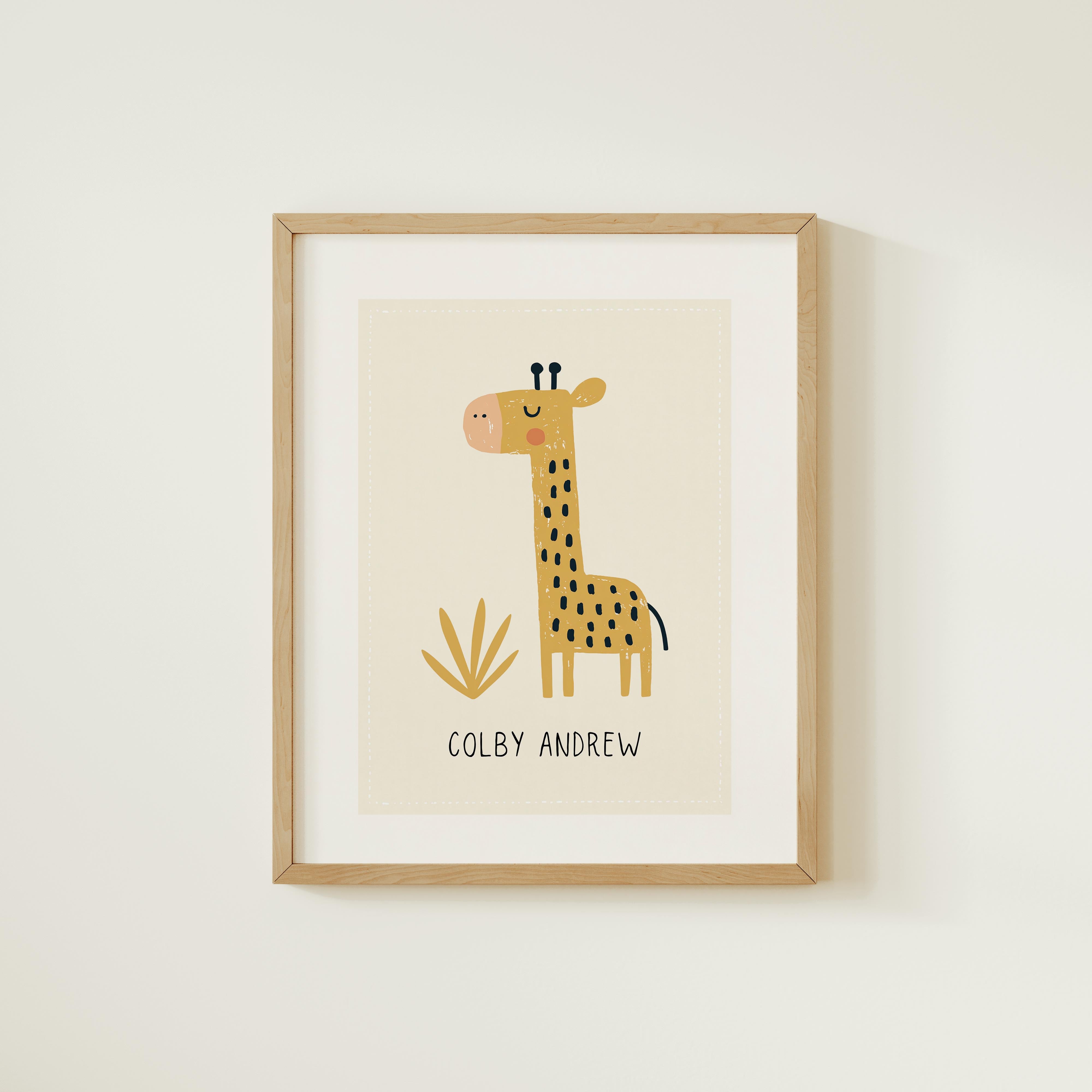 A framed print of a giraffe with the name "COLBY ANDREW" below it.