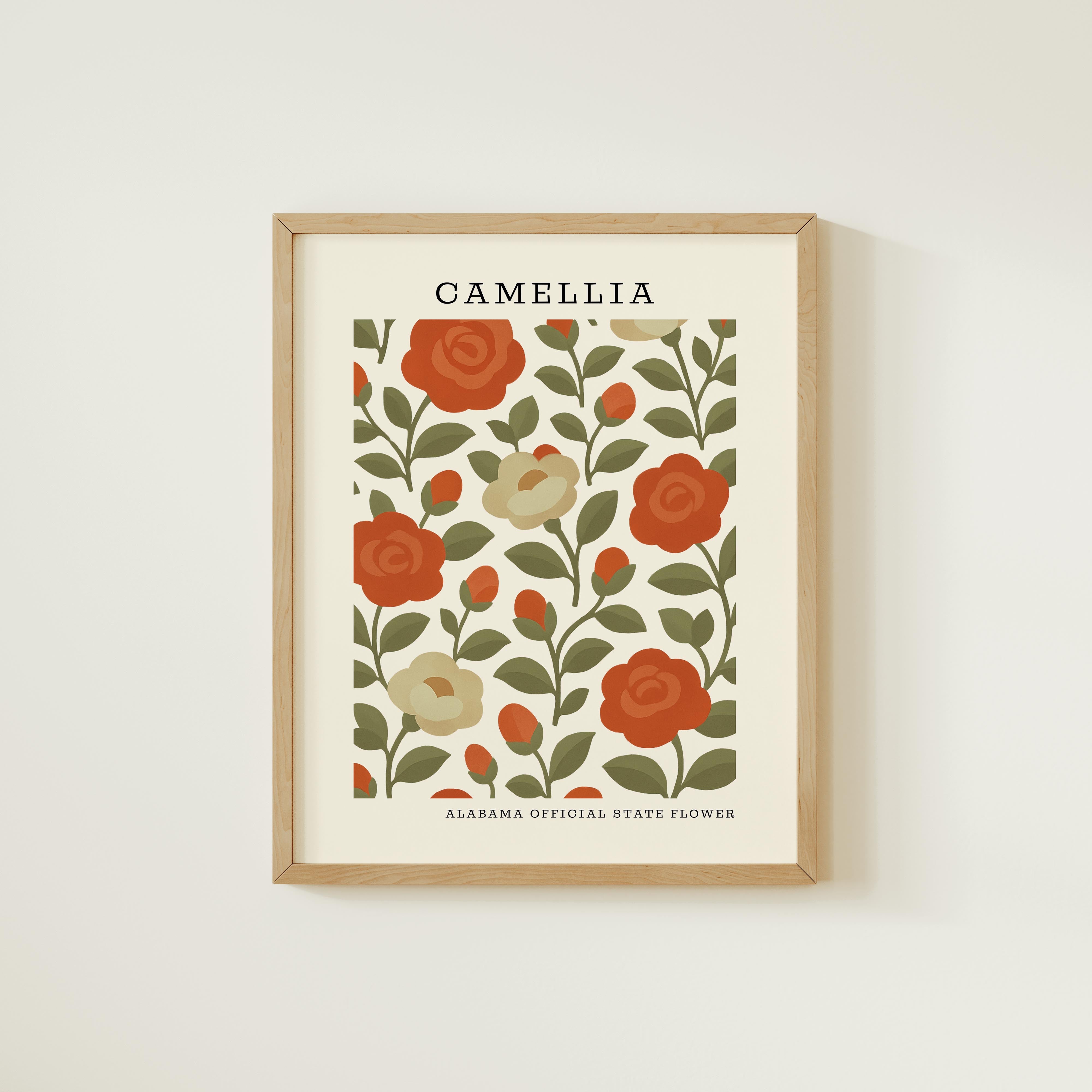 The image is a framed poster or artwork featuring a floral pattern with red roses and green leaves. The text "CAMELIA" is displayed at the top of the poster, and "ALABAMA OFFICIAL STATE FLOWER" is written at the bottom.