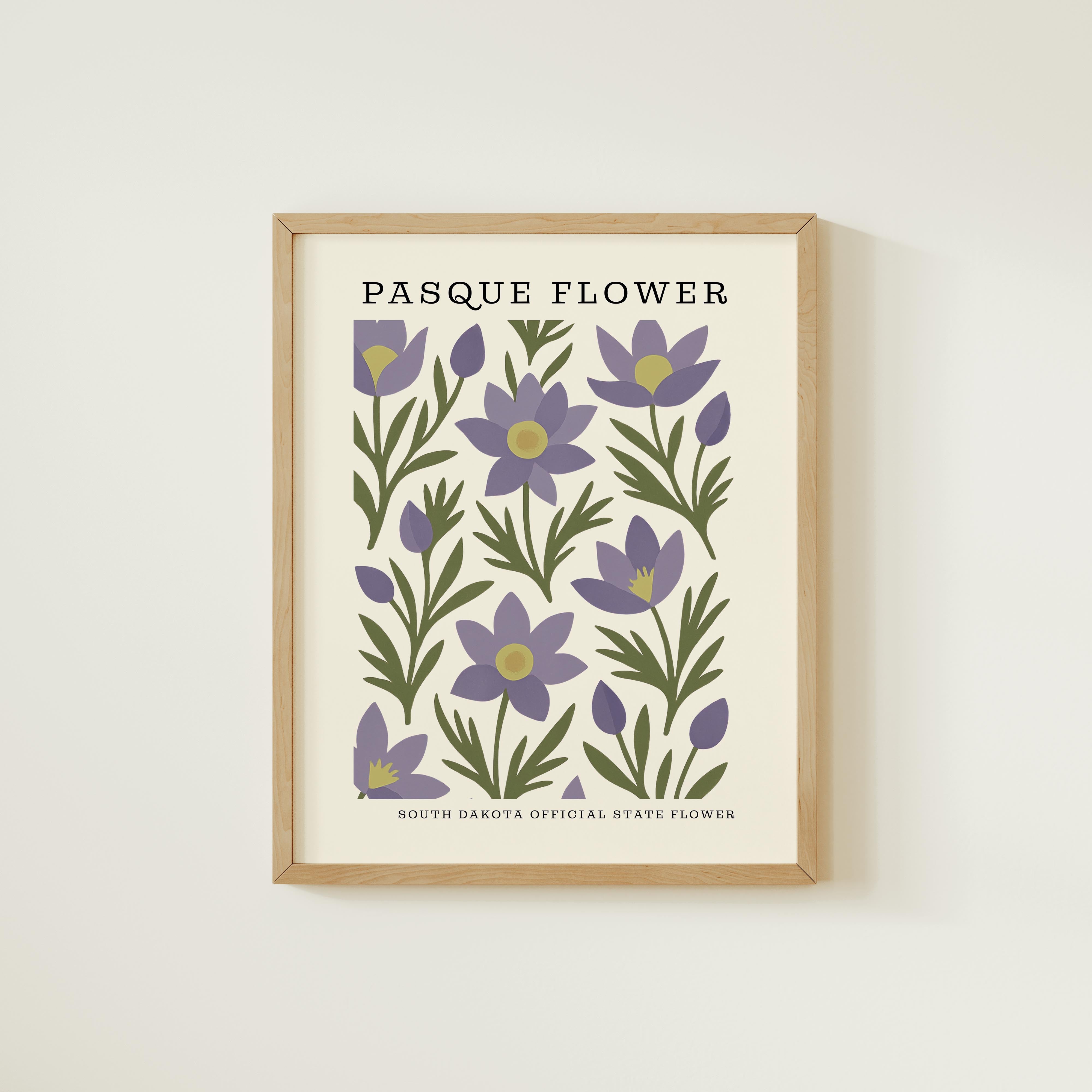 The image is a framed print featuring a repeating pattern of purple flowers with green leaves, titled "PASQUE FLOWER" and "SOUTH DAKOTA OFFICIAL STATE FLOWER".