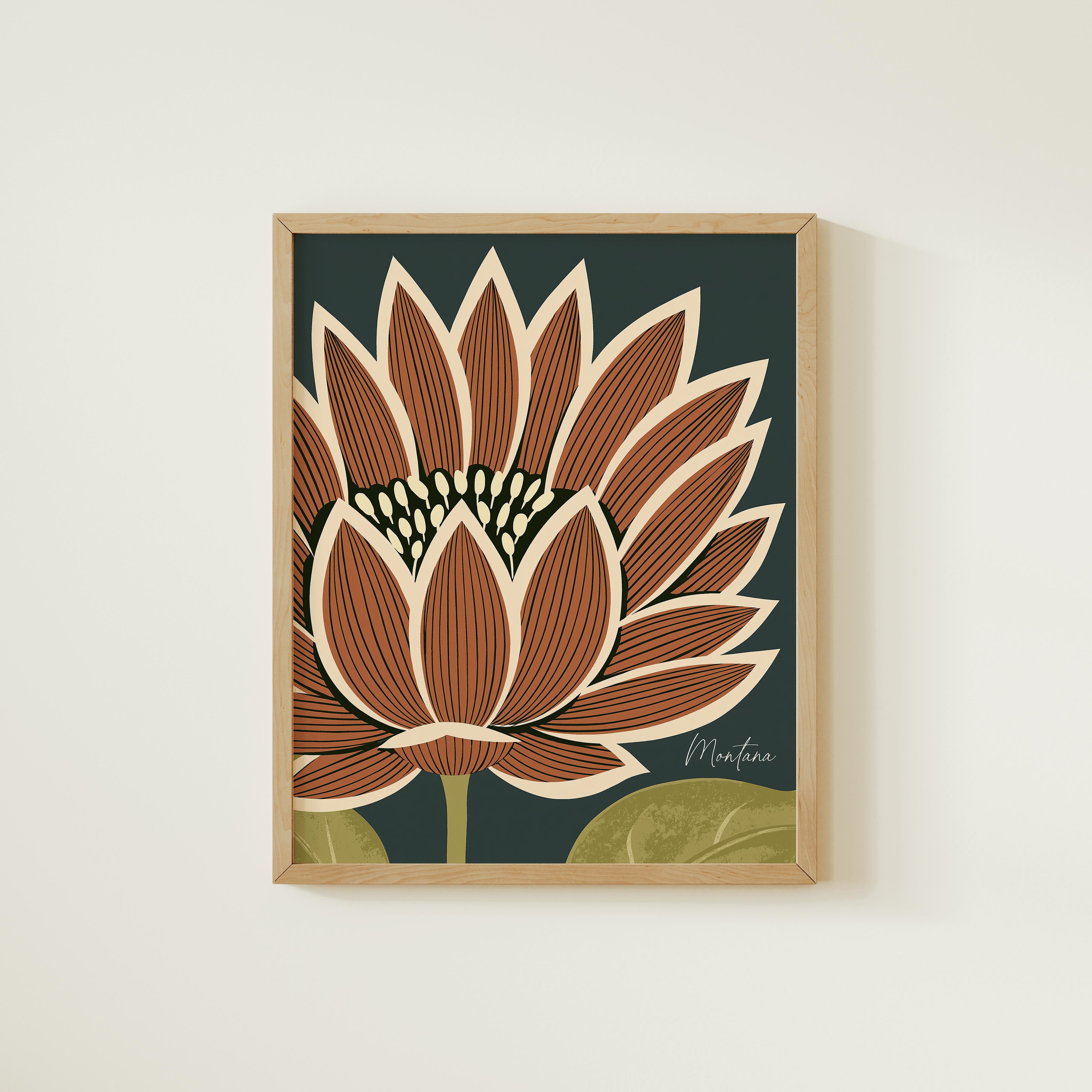 a framed artwork of a large, vibrant flower with a dark background and a green leaf.