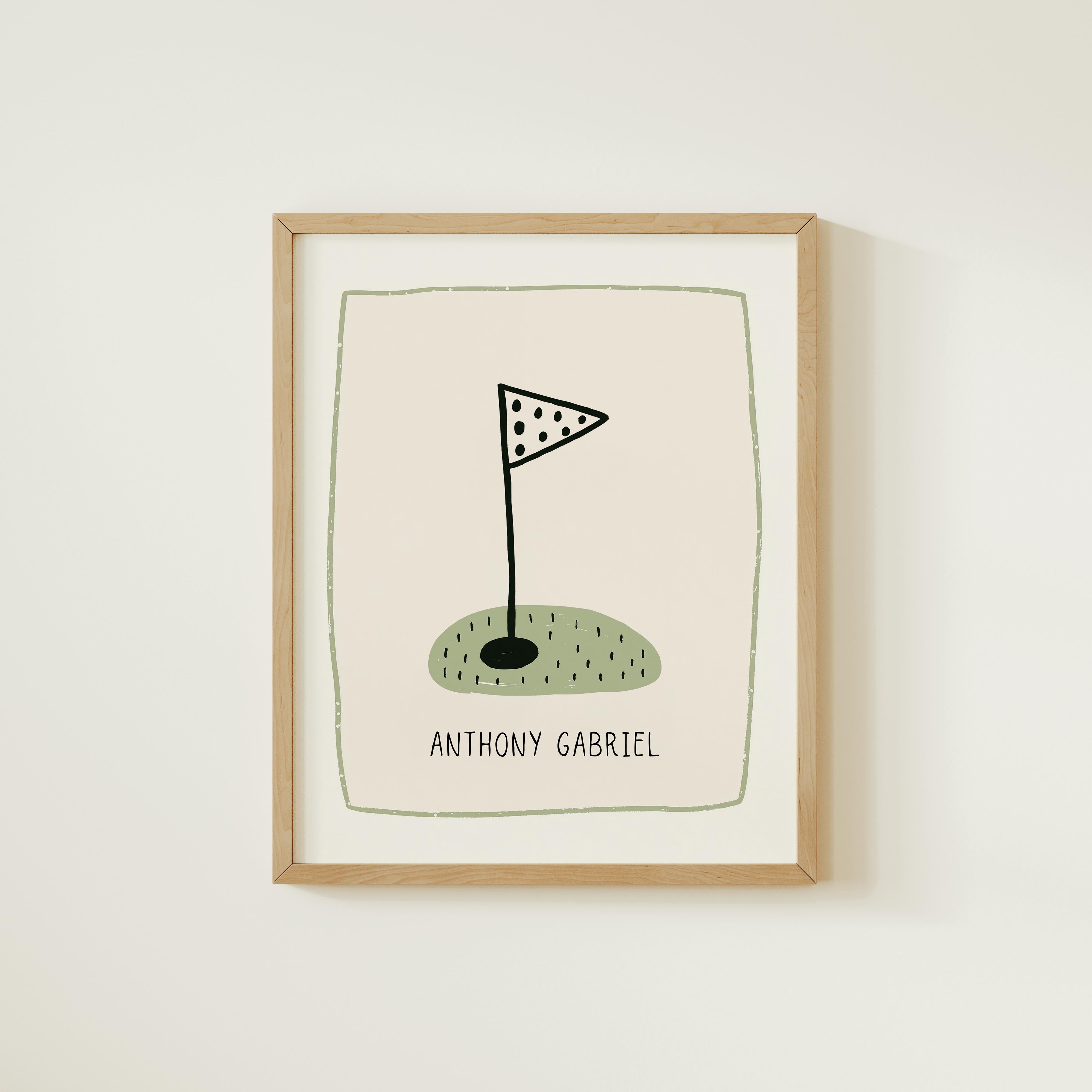 The image is a framed print featuring a golf flag on a green field, with the name "Antony Gabriel" written below it.