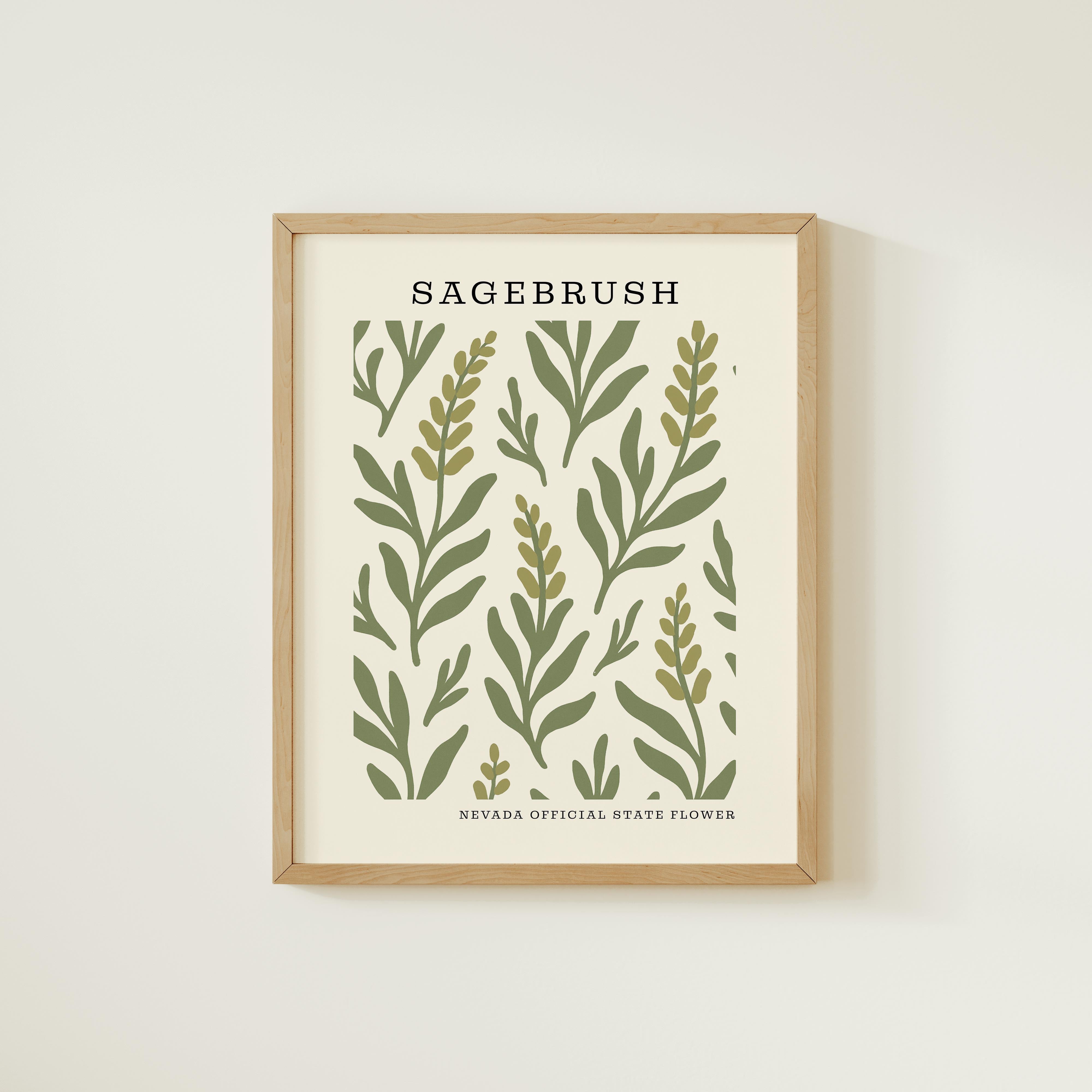 The image is a framed print featuring a repeating pattern of green leaves and branches, with the text "SAGEBRUSH" prominently displayed above the pattern.