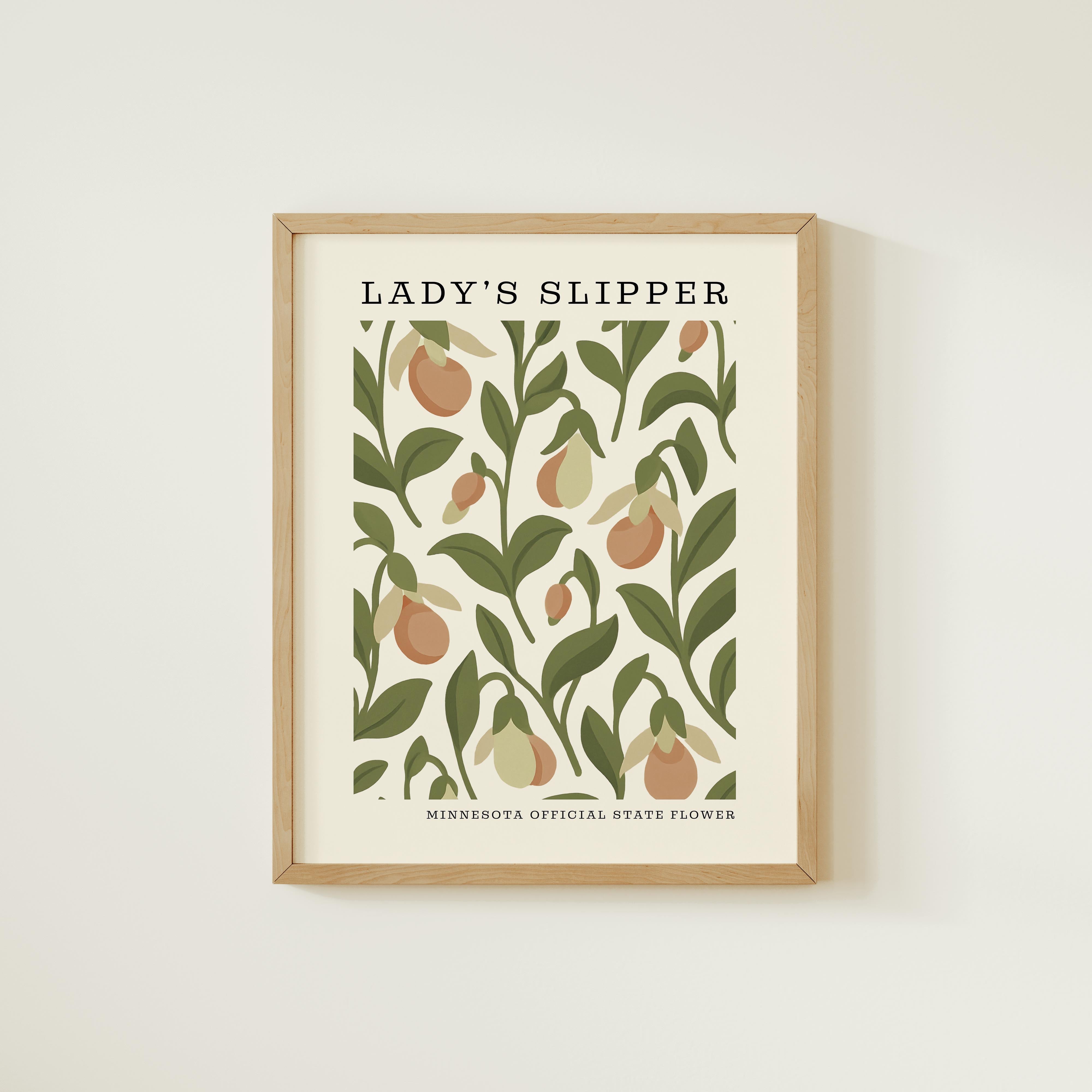 The image is a framed poster featuring a repeating pattern of leaves and flowers in shades of green and brown.