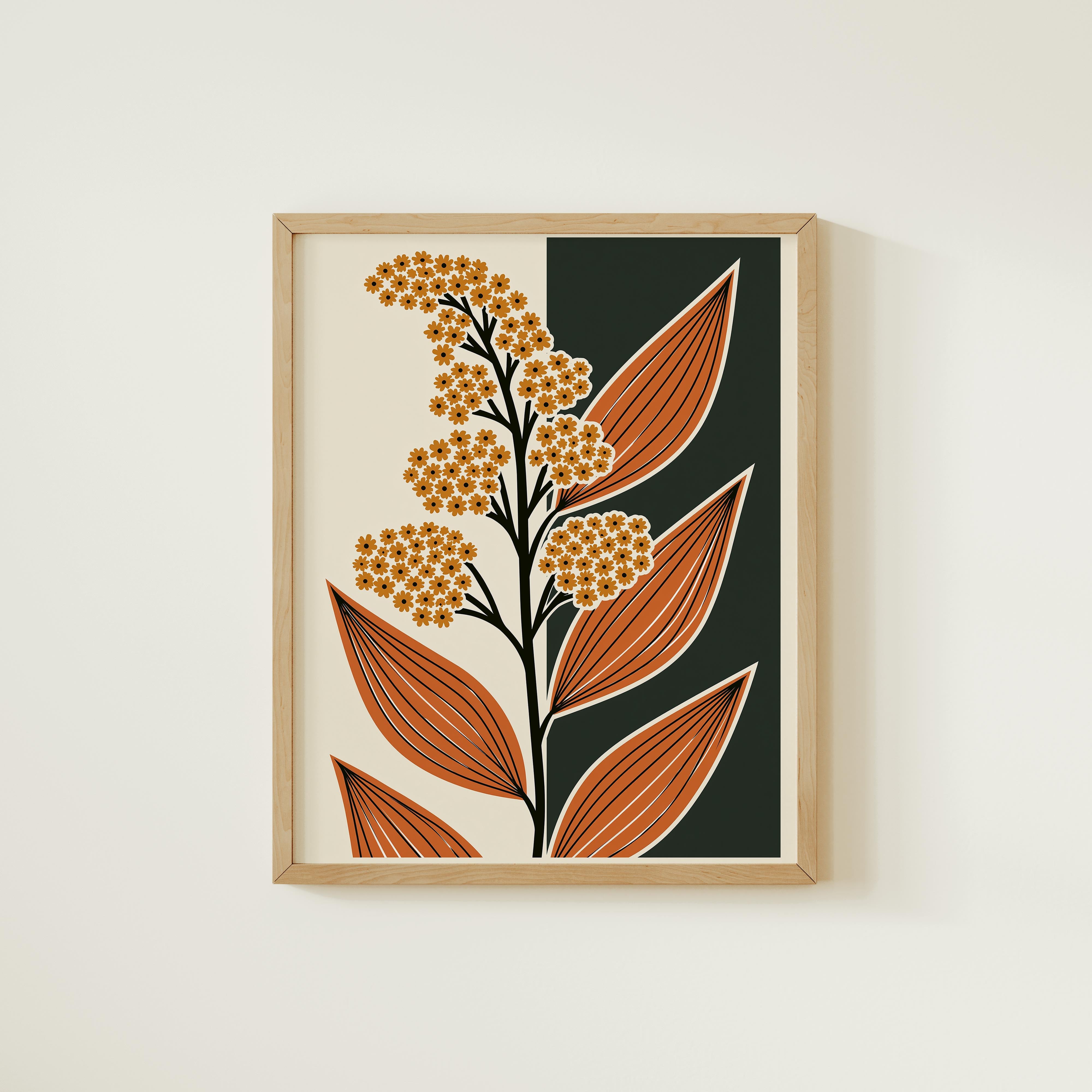 The image is a framed print featuring a stylized floral design with orange and green leaves.