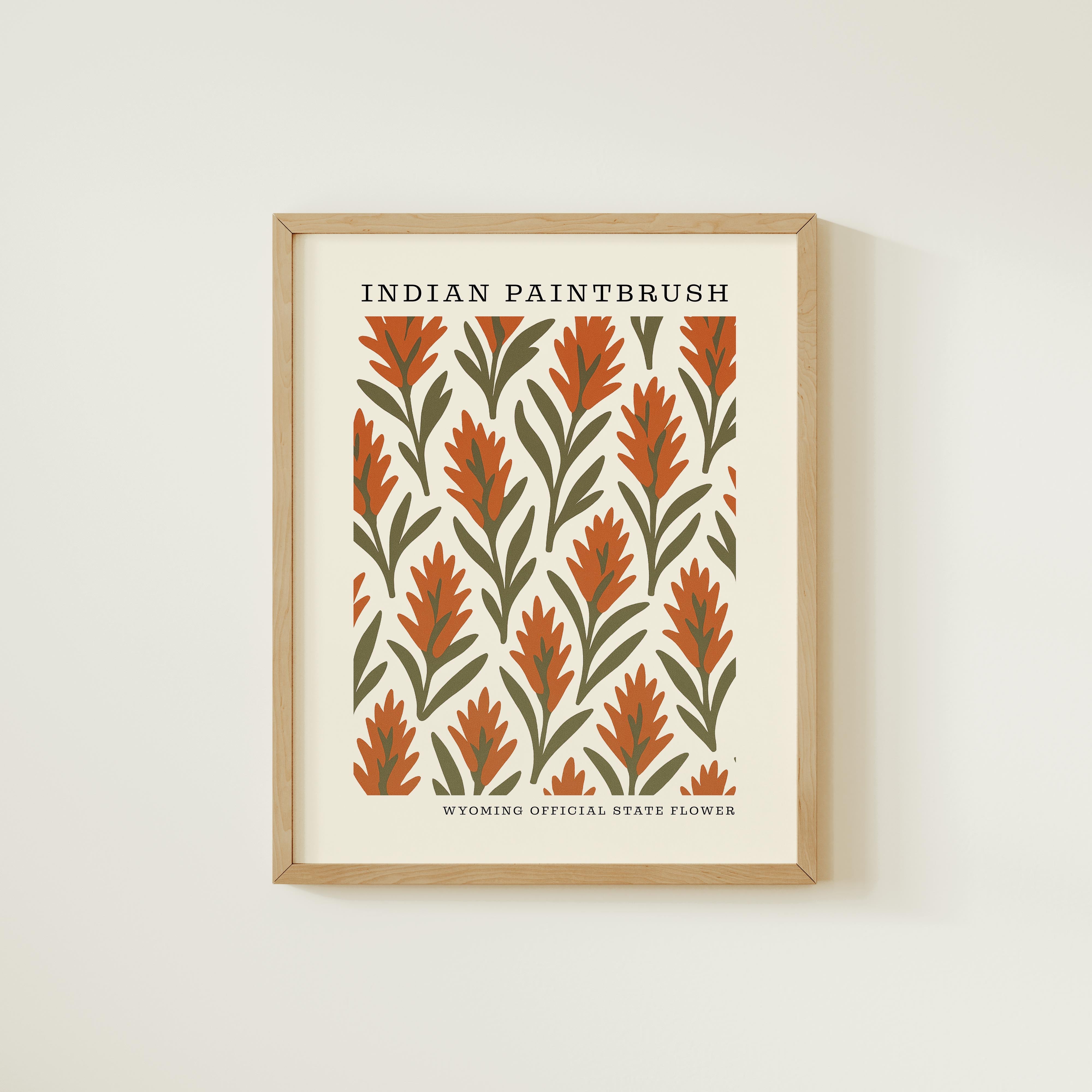 The image is a framed print featuring a repeating pattern of orange and green flowers or leaves.